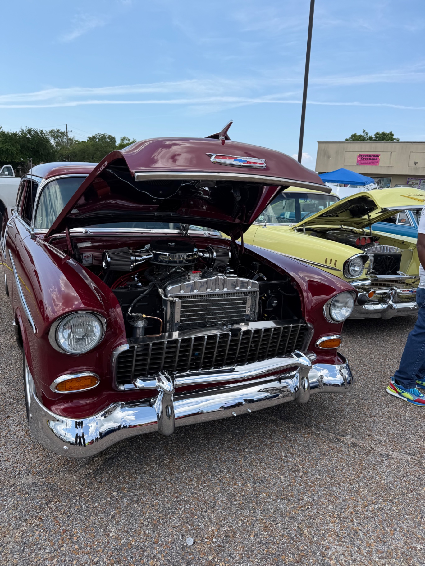 Burgundy 1955 Chevy Bel Air with hood up at a Blunt's Auto Parts cruise night